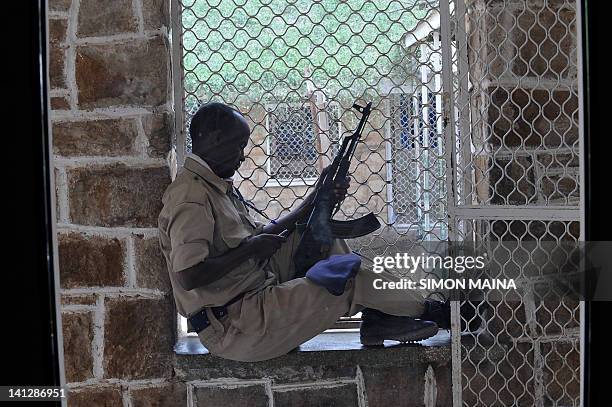 Somaliland prison warden sits on March 8, 2012 in Hargesia's newly-refurbished prison in the northern breakaway nation of war-torn Somalia. Officers...