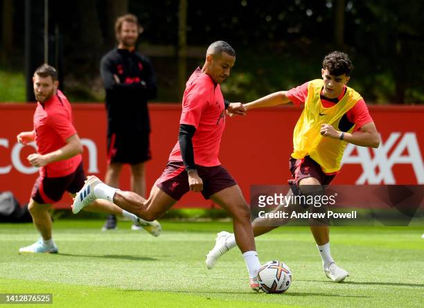 Thiago Alcantara and Stefan Bajcetic of Liverpool during a training session at AXA Training Centre on August 04, 2022 in Kirkby, England.