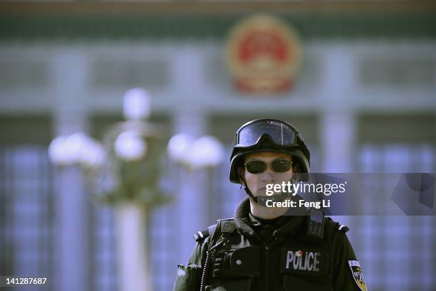 Policeman guards after the closing session of the National Peoples Congress outside The Great Hall Of The People on March 14, 2012 in Beijing, China....