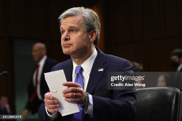 Director Christopher Wray waits for the beginning of a hearing before Senate Judiciary Committee at Hart Senate Office Building on Capitol Hill...