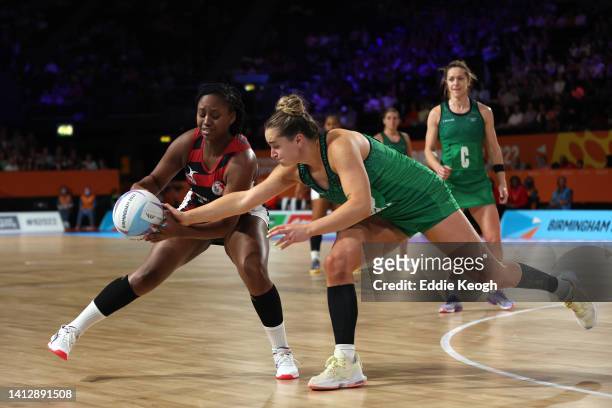 Michelle Magee of Team Northern Ireland and Tahirah Hollingsworth of Team Trinidad & Tobago contend for the ball during the Women's Netball Pool B...