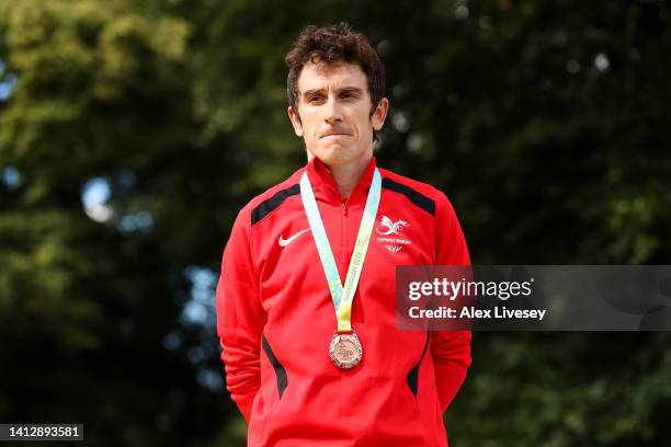 Bronze Medalist, Geraint Thomas of Team Wales stands on the podium during the Men's Individual Time Trial medal ceremony on day seven of the...