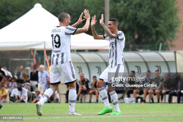Leonardo Bonucci of Juventus celebrates with Angel Di Maria after scoring the his team's second goal during the Pre-season Friendly match between...