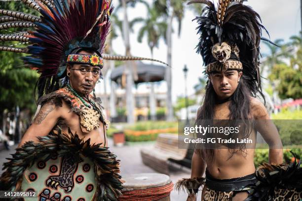 portrait of aztec performers outdoors - aztec warrior stock pictures, royalty-free photos & images