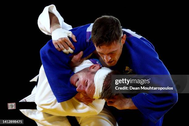 Nathan Katz of Team Australia competes against Gregg Varey of Team Wales during the Men's Judpo 66 kg Repechage match on day four of the Birmingham...