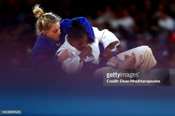 Michaela Whitebooi of Team South Africa competes against Ashleigh-Anne Barnikel of Team Wales during the Women's - 48 kg fight on day four of the...