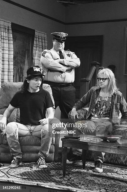 Episode 7 -- Pictured: Mike Myers as Wayne Campbell, John Goodman as Mark Wilson, Dana Carvey as Garth Algar during "Wayne's World" skit on December...