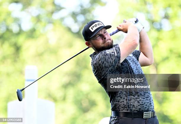 Tyrrell Hatton of England plays his shot from the 15th tee during the first round of the Wyndham Championship at Sedgefield Country Club on August...