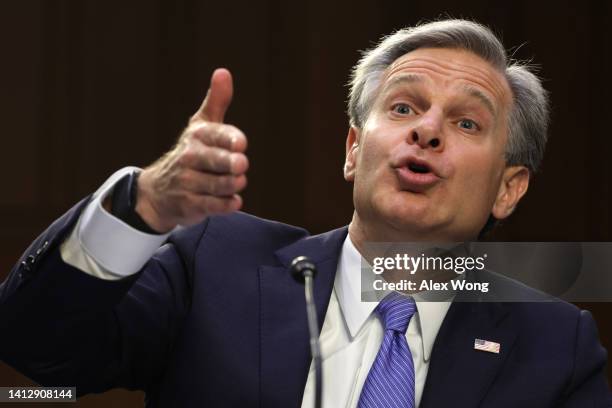 Director Christopher Wray testifies during a hearing before Senate Judiciary Committee at Hart Senate Office Building on Capitol Hill August 4, 2022...