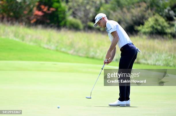Will Zalatoris of the United States putts on the ninth green during the first round of the Wyndham Championship at Sedgefield Country Club on August...