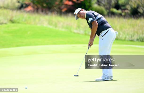 Sungjae Im of Korea putts on the ninth green during the first round of the Wyndham Championship at Sedgefield Country Club on August 04, 2022 in...