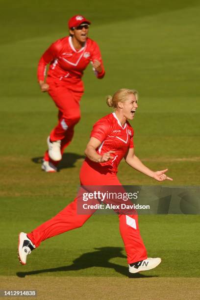 Katherine Brunt of Team England celebrates taking the wicket of Sophie Devine of Team New Zealand during the Cricket T20 Group B match between Team...