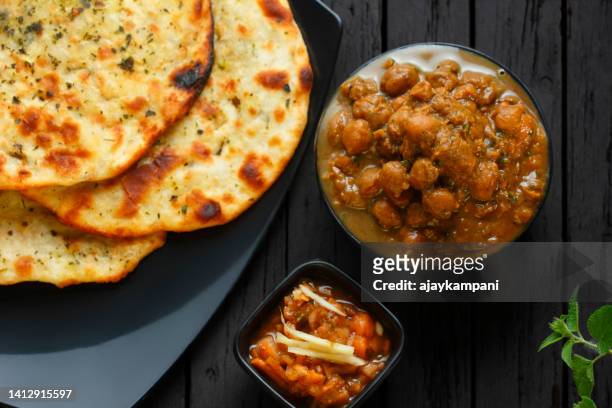 amritsari kulche and chole - parantha stock pictures, royalty-free photos & images