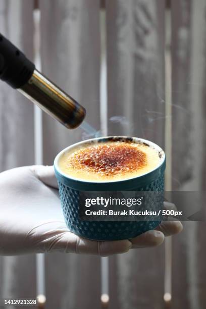 cropped hand pouring coffee in cup,fatih,turkey - creme brulee stock pictures, royalty-free photos & images