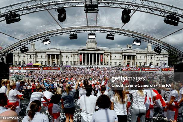 The England celebrates with the fans during the England Women's Team Celebration at Trafalgar Square on August 01, 2022 in London, England. The...