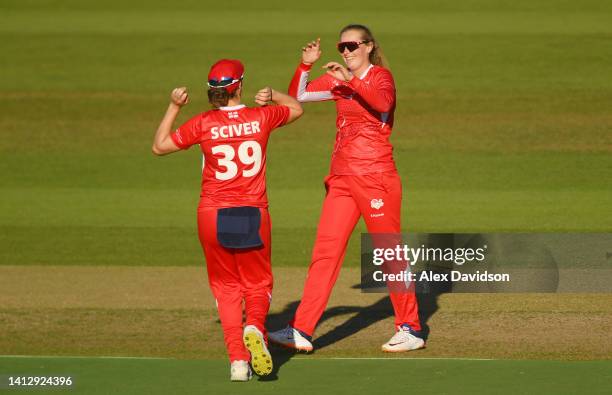 Sophie Ecclestone of Team England celebrates with teammate Nat Sciver after the wicket of Maddy Green of Team New Zealand during the Cricket T20...