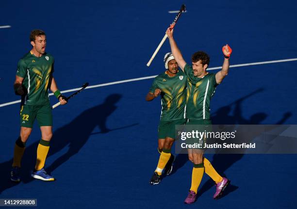 Matthew Guise-Brown of Team South Africa celebrates after scoring their sides first goal during Men's Hockey - Pool A match between South Africa and...