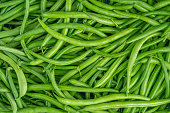 Fresh green bean pods texture. Close up, top view