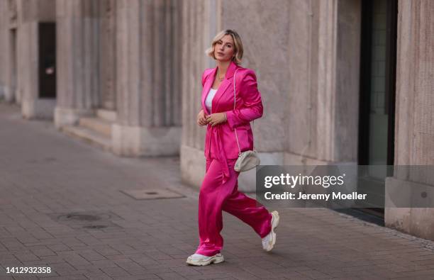 Franzi Koenig wearing a Zara matching pink blazer and pants, Fafe Collection jewelry, a beige Bottega Veneta bag and white Balenciaga sneaker on...