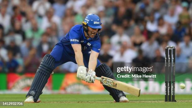 Eoin Morgan of London Spirit Men plays a sweep shot during The Hundred match between Oval Invincibles Men and London Spirit Men at The Kia Oval on...