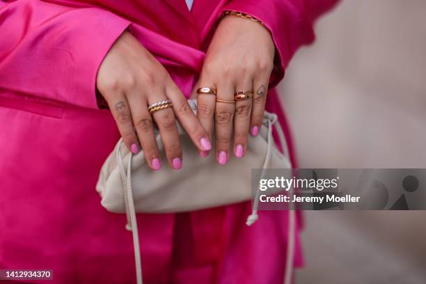 Franzi Koenig wearing a Zara matching pink blazer and pants, Fafe Collection jewelry, a beige Bottega Veneta bag on August 02, 2022 in Cologne,...