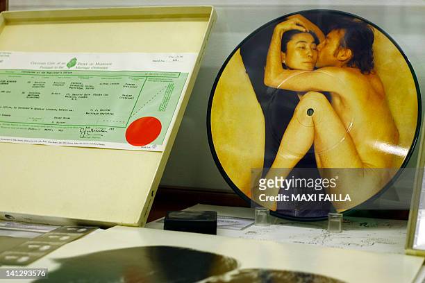 Picture of a copy of the marriage certificate of John Lennon and Yoko Ono and a CD of the couple on display at the Beatles museum, in Buenos Aires,...