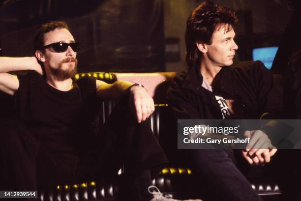 View of British Rock musician Graham Parker and Australian-born American Pop musician & actor Rick Springfield during an interview on MTV at...