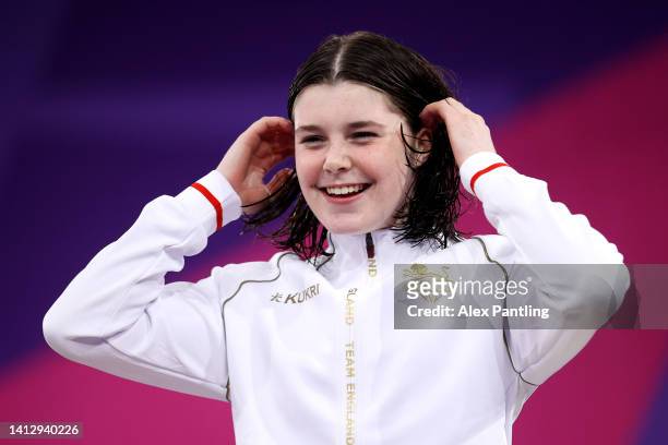 Gold medalist, Andrea Spendolini Sirieix of Team England reacts during the medal ceremony for the the Women's 10m Platform Final on day seven of the...