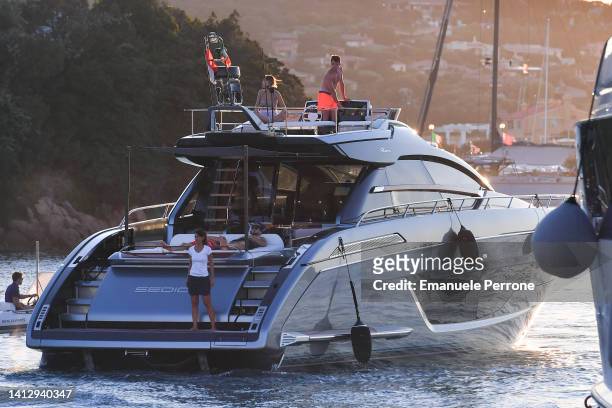 Ferrari Formula 1 driver Charles Leclerc at the helm of his Yacht Riva on holiday in Porto Cervo on August 04, 2022 in Porto Cervo, Sardinia Italy.