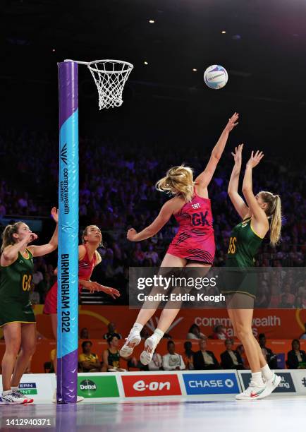 Ine-Mari Venter of Team South Africa shoots as Lauren Tait of Team Scotland attempts to block during the Netball Pool A match between Team South...