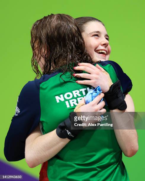 Tanya Rachel Watson of Team Northern Ireland congratulates Gold medalist, Andrea Spendolini Sirieix of Team England after the Women's 10m Platform...
