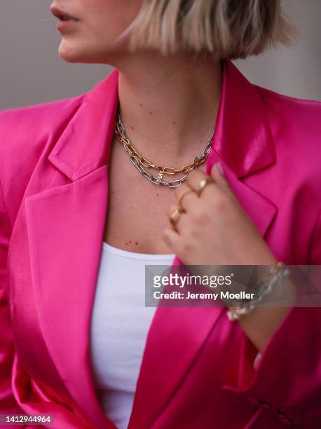 Franzi Koenig wearing a Zara pink blazer, Fafe Collection jewelry on August 02, 2022 in Cologne, Germany.