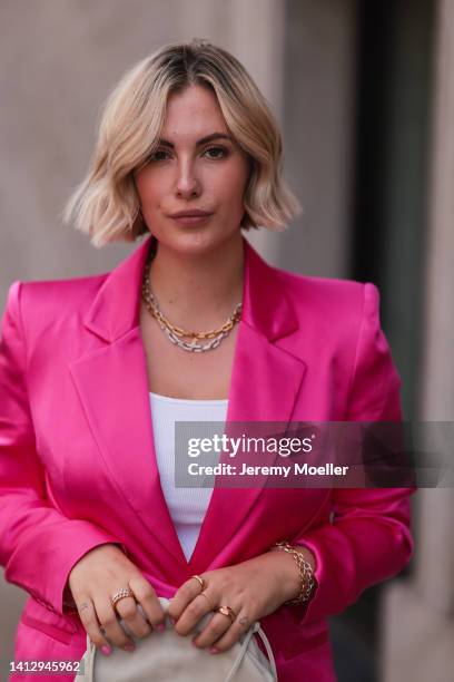 Franzi Koenig wearing a Zara pink blazer, Fafe Collection jewelry on August 02, 2022 in Cologne, Germany.
