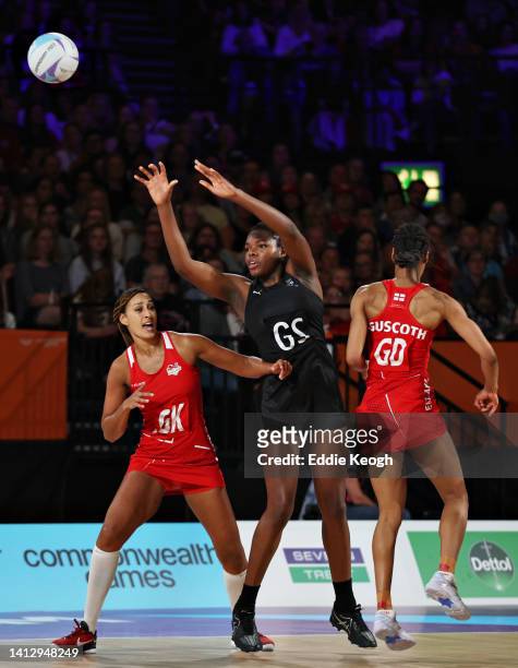Grace Nweke of Team New Zealand competes for the ball with Geva Mentor and Layla Guscoth of Team England during the Netball Pool B match between Team...