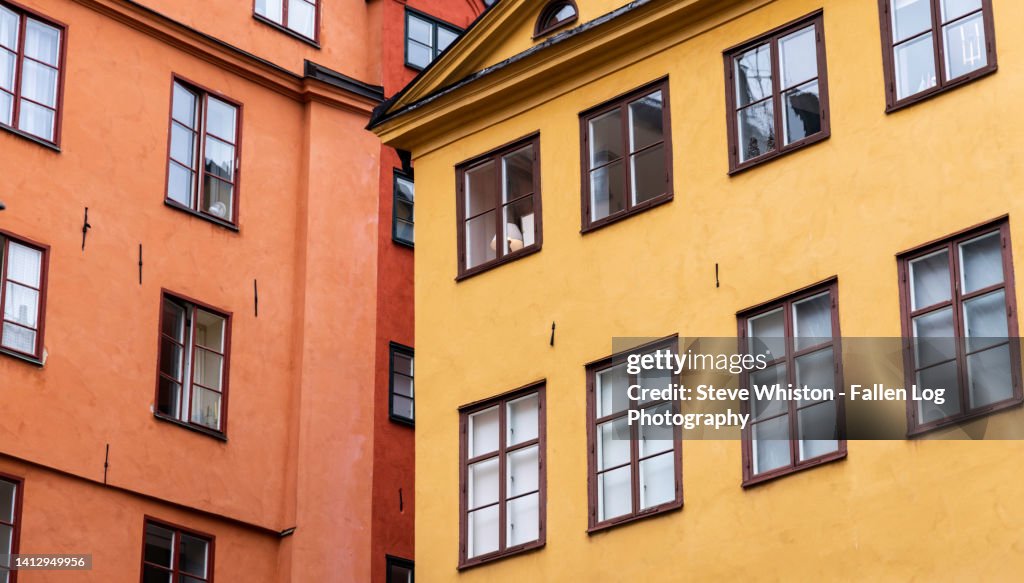 Two Colorful Apartment Buildings Meet in Gamla Stan - Typical Charming Architecture in Stockholm's Old Town