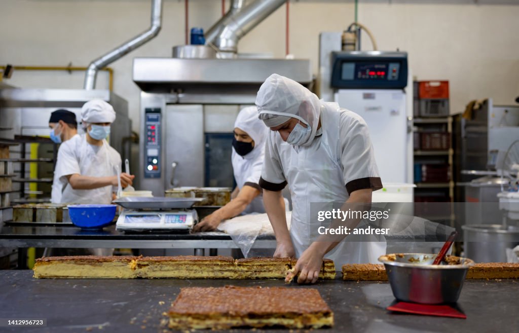 Bakery Making Workers Working At A Bakery Making Pastry Items High-Res Stock Photo ...