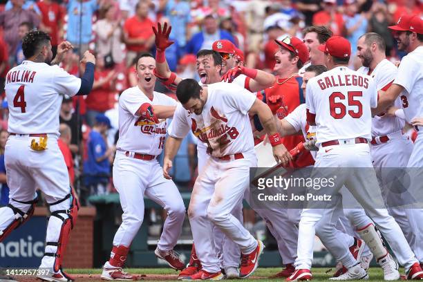 Lars Nootbaar of the St. Louis Cardinals is congratulated after hitting a walk-off single against the Chicago Cubs in game one of a double header at...