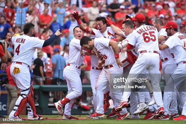 Lars Nootbaar of the St. Louis Cardinals is congratulated after hitting a walk-off single against the Chicago Cubs in game one of a double header at...