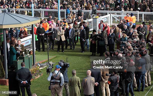 Camilla, Duchess Of Cornwall makes a presentation to the winners of the first race in the winners enclosure on Ladies Day at the Cheltenham Festival...