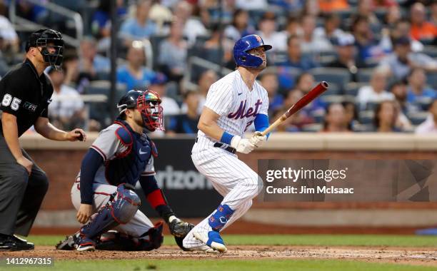 Tyler Naquin of the New York Mets hits a solo home run against the Atlanta Braves in the second inning at Citi Field on August 04, 2022 in New York...