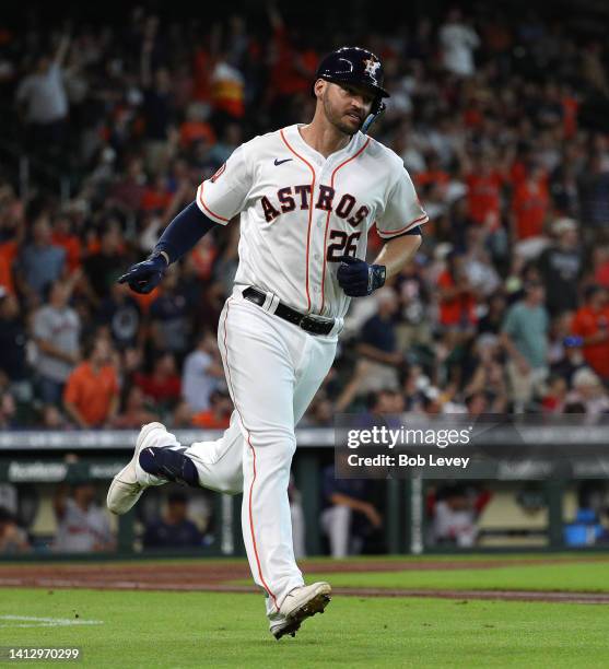 Trey Mancini of the Houston Astros hits a two run home run against the Boston Red Sox at Minute Maid Park on August 01, 2022 in Houston, Texas.