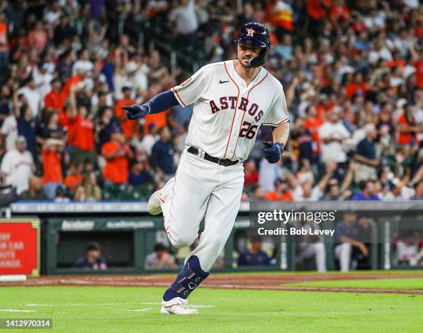 Trey Mancini of the Houston Astros hits a two run home run against the Boston Red Sox at Minute Maid Park on August 01, 2022 in Houston, Texas.