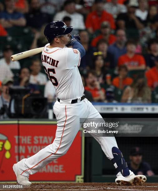 Trey Mancini of the Houston Astros hits a two run home run against the Boston Red Sox at Minute Maid Park on August 01, 2022 in Houston, Texas.