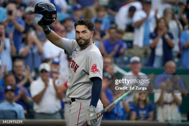 Eric Hosmer of the Boston Red Sox tips his cap to the crowd as he prepares to bat against the Kansas City Royals in the first inning at Kauffman...