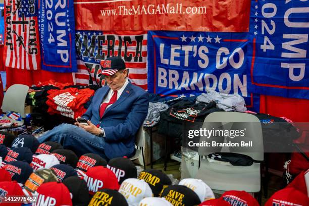 Vendor sits with their merchandise at the Conservative Political Action Conference CPAC held at the Hilton Anatole on August 04, 2022 in Dallas,...