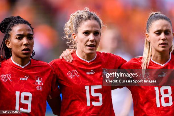 Eseosa Aigbogun Luana Buhler and Viola Calligaris of Switzerland singing the National Anthem during the UEFA Women's Euro England 2022 group C match...