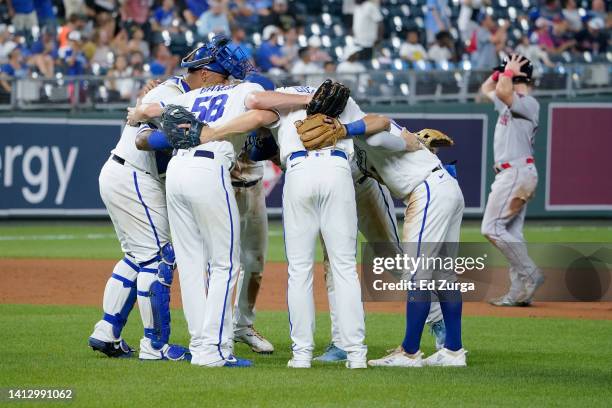 Members of the Kansas City Royals celebrate a 7-3 win over the Boston Red Sox at Kauffman Stadium on August 04, 2022 in Kansas City, Missouri.