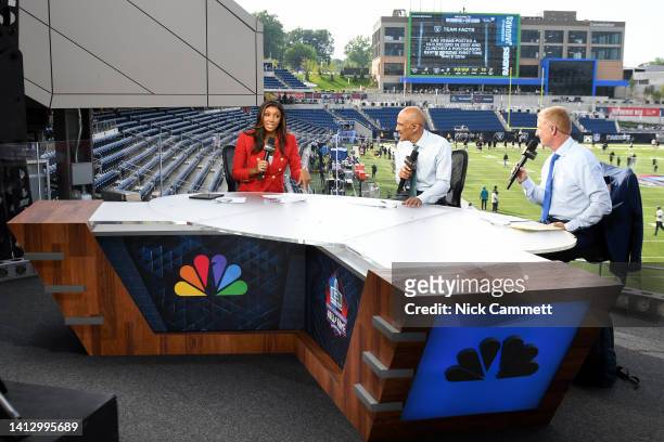 Sports commentator Maria Taylor speaks during a segment with analysts Tony Dungy and Jason Garrett prior to the 2022 Pro Hall of Fame Game between...