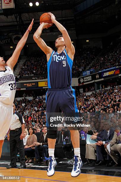 Yi Jianlian of the Dallas Mavericks shoots the ball over Francisco Garcia of the Sacramento Kings on March 09 2012 at Power Balance Pavilion in...