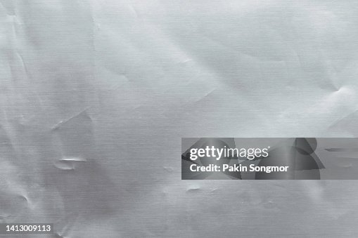 Close up of silver plastic foil background. Abstract background of silver color from paper. Close up of silver plastic foil background. Abstract background of silver color from paper.